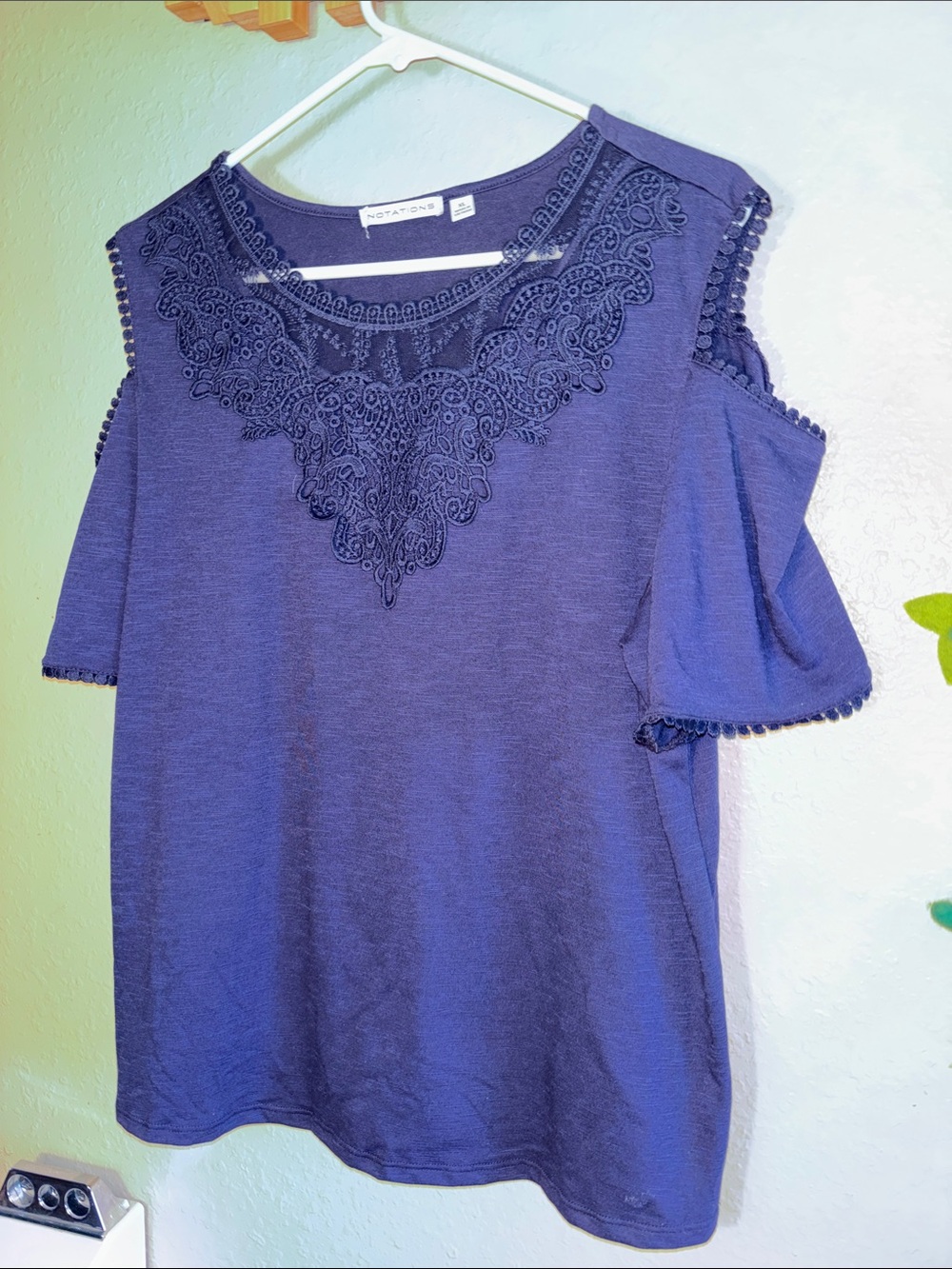 NWOT Notations short-sleeve top featuring intricate lace trim around the necklin